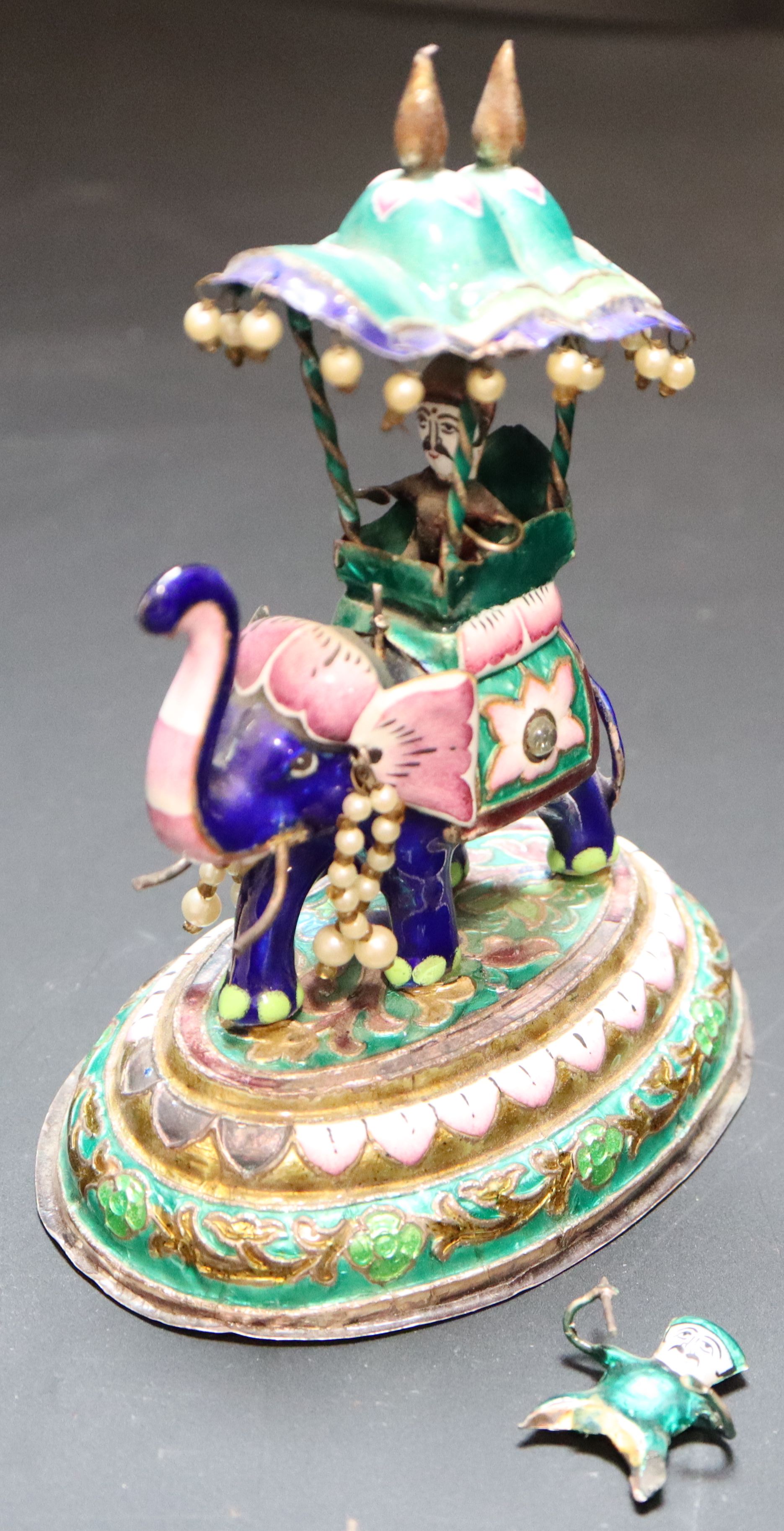 An Indian enamelled white metal miniature elephant with howdah, height 13.7cm, gross 295 grams.